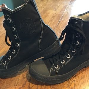 Black high top Converse shoes